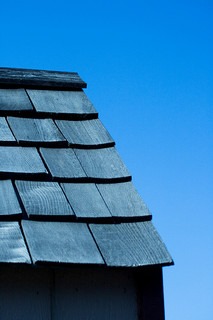 Roof of shingles and blue sky
