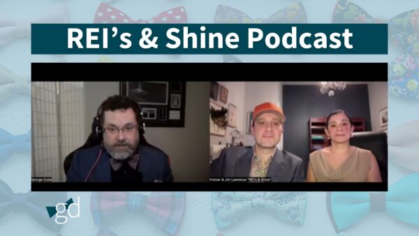 Bearded man in glasses and bow tie talking to a man and woman for a podcast