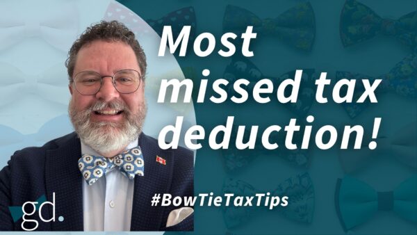 Man with dark, curly hair, beard, and glasses, with blue flowered bow tie and dark jacket talking about deducting interest expenses