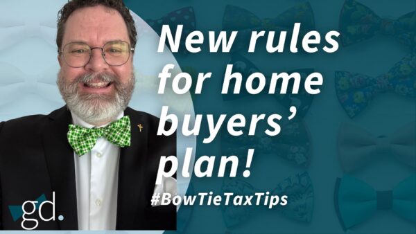 White man with white beard and glasses, in a green bow tie and navy suit jacket talking about Home Buyer's Plan Changes