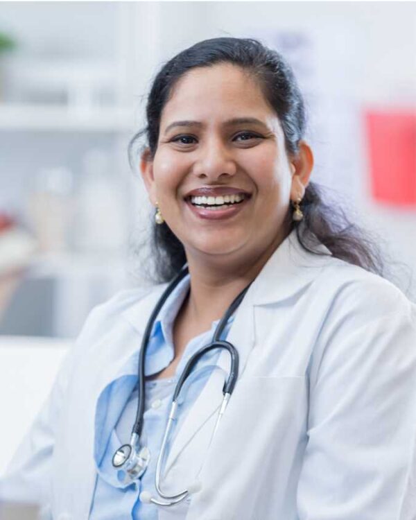 Middle-aged women, long dark hair, wearing white lab coat, stethoscope